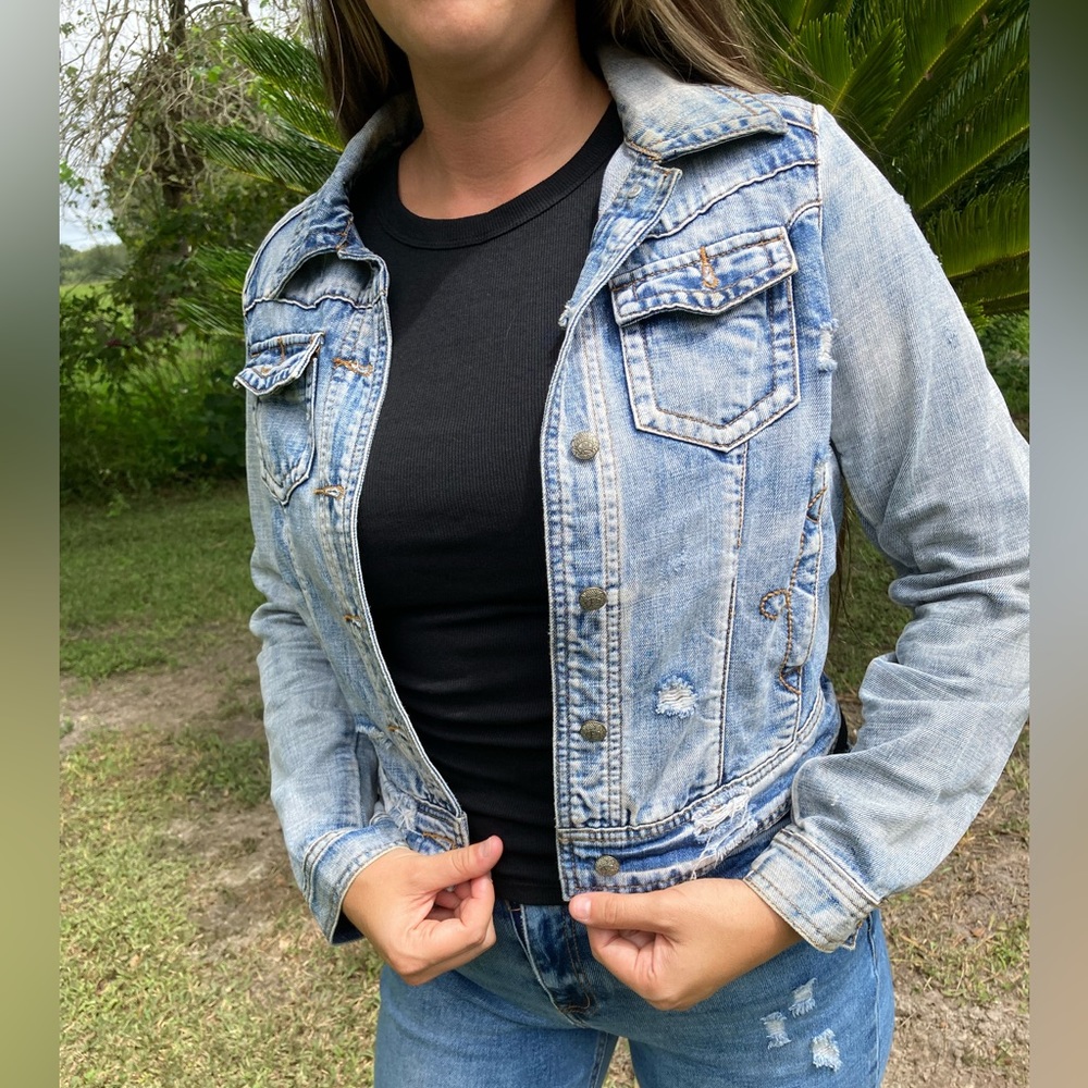 Distressed denim jacket